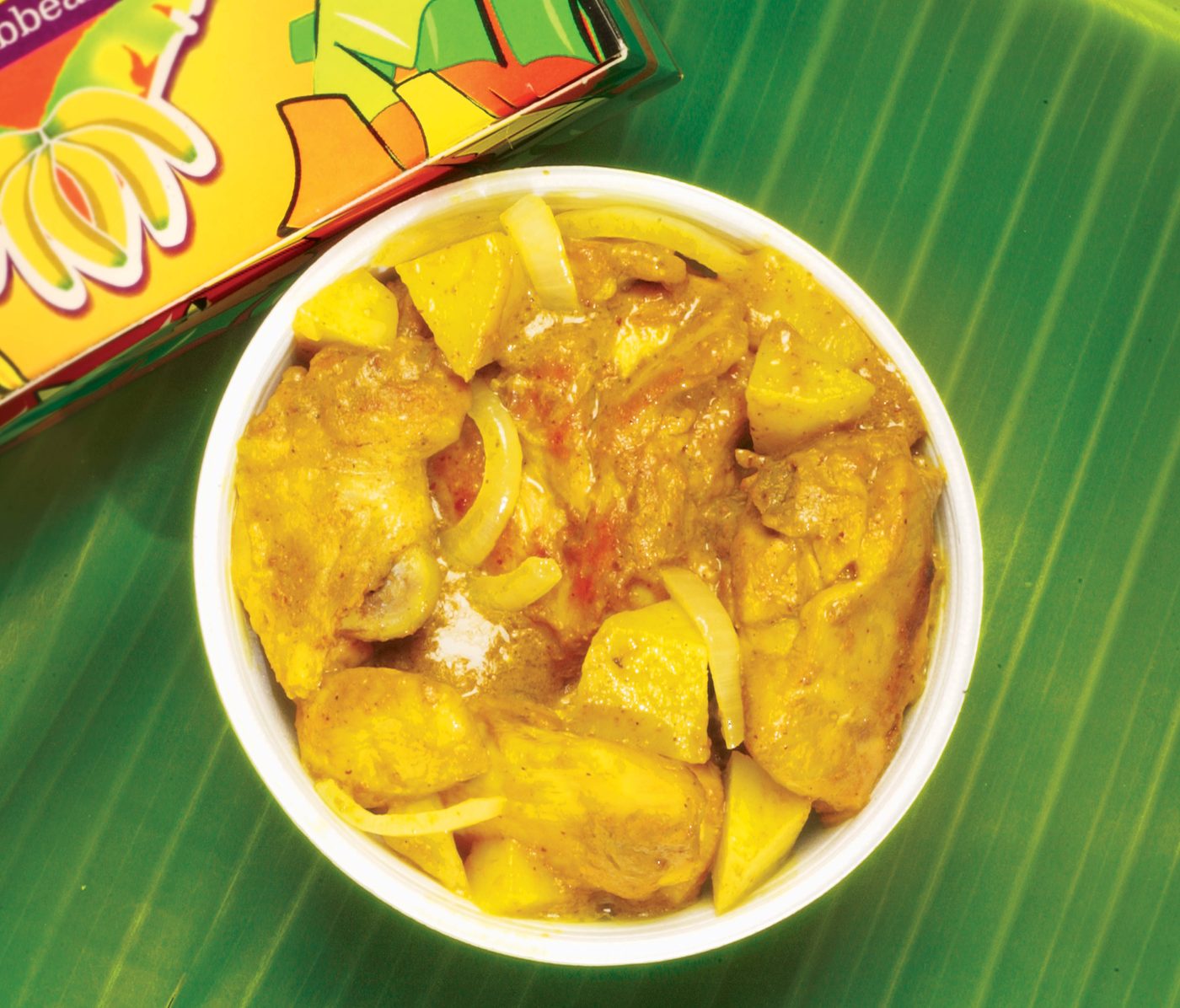 Bowl of golden curry chicken with potatoes